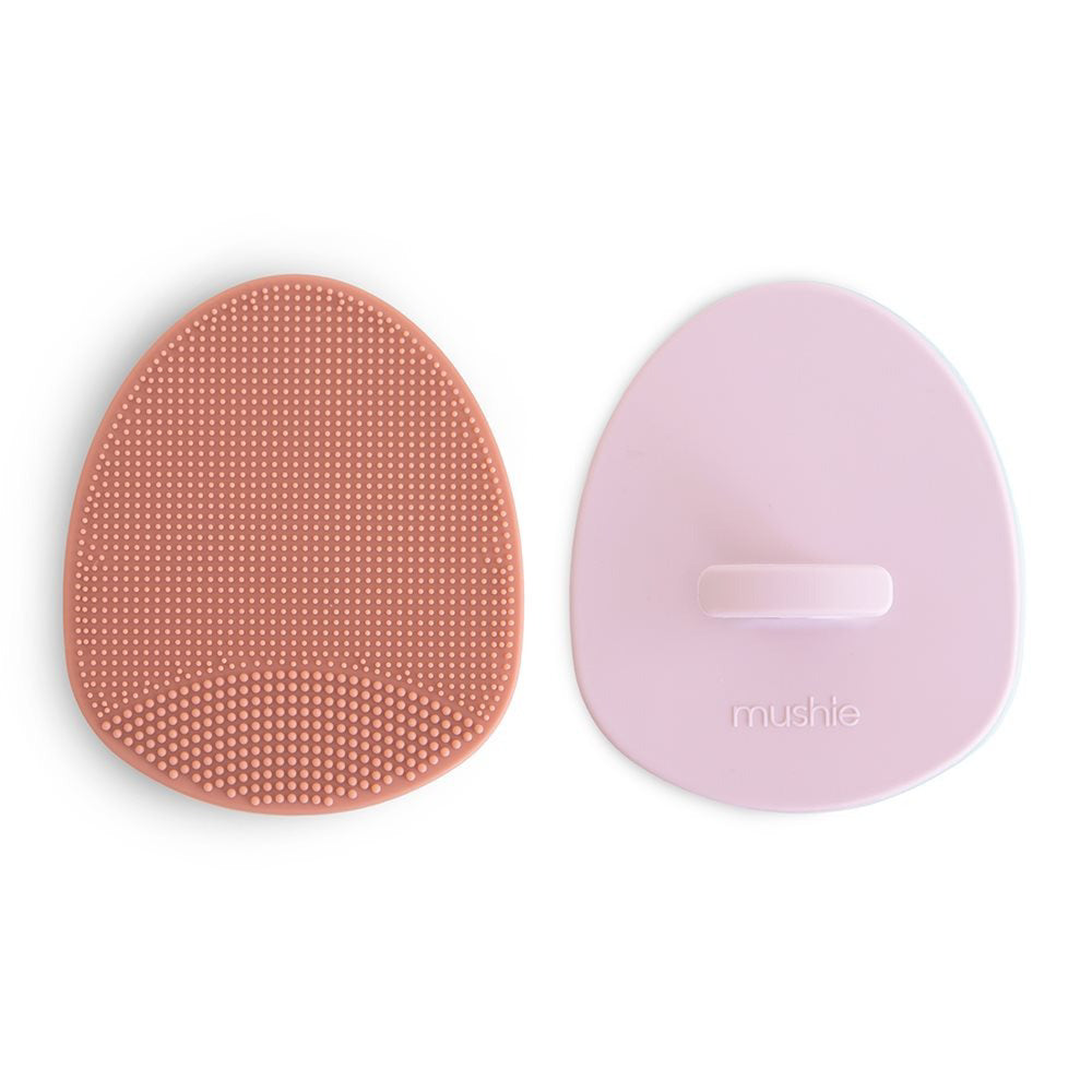Mushie® Silikonska krtača za odstranjevanje lusk 2 kosa Rose/Soft Lilac Mushie