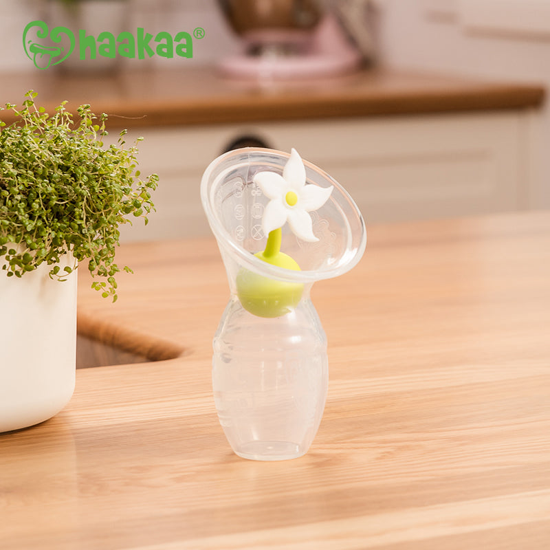 Haakaa® Set silikonska črpalka 1.gen. 100ml in Pokrovček Rožica Haakaa