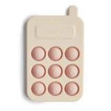 Mushie® Silikonová aktivizační hračka Telefon Blush
