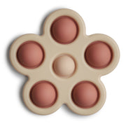Mushie® Otroška igrača POP-IT Flower Rose/Blush/Shifting Sand Mushie