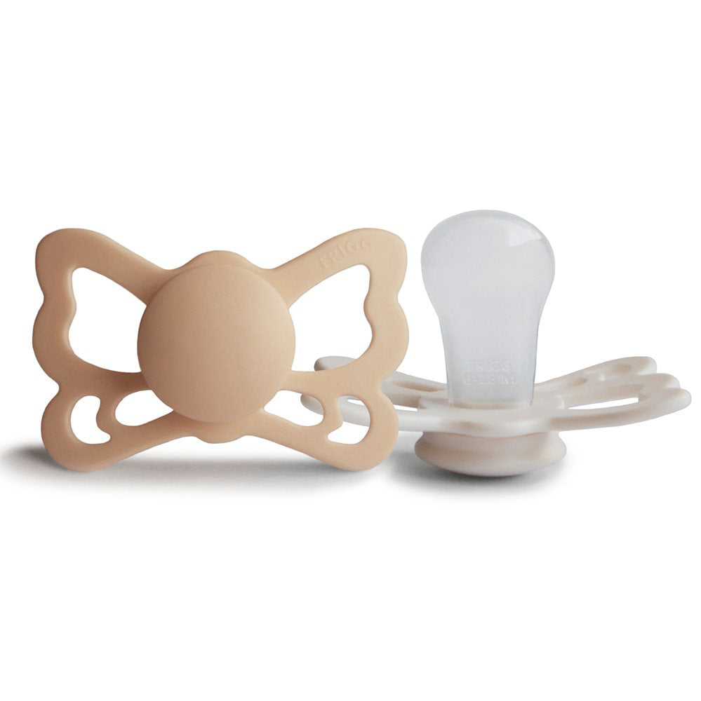 Frigg® Anatomska Duda iz silikona Butterfly Silky Satin/Cream (6-18m) FRIGG