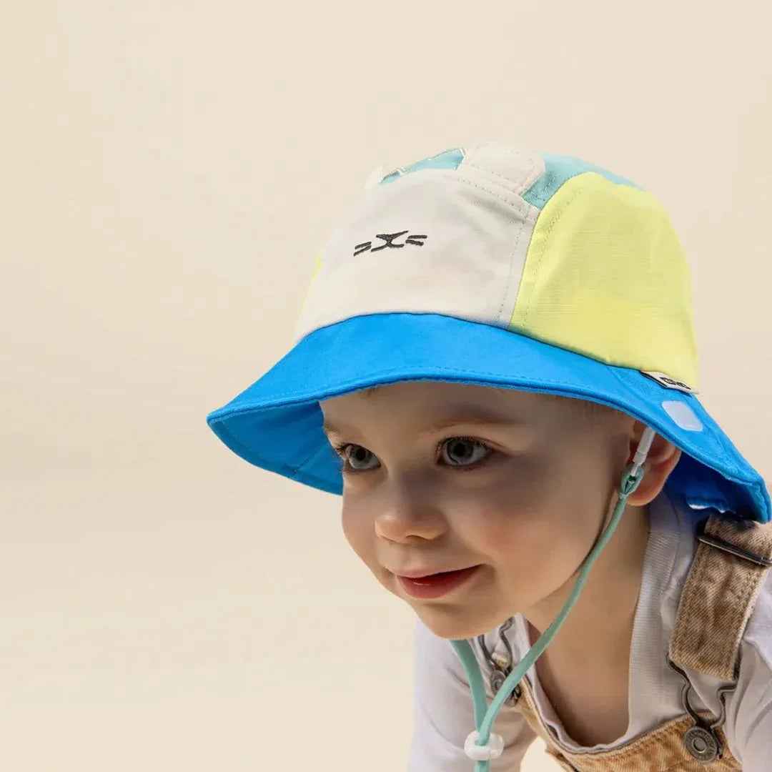 KiETLA® Klobuček Camper Hat Lion Vert Yellow Blue Ki ET LA