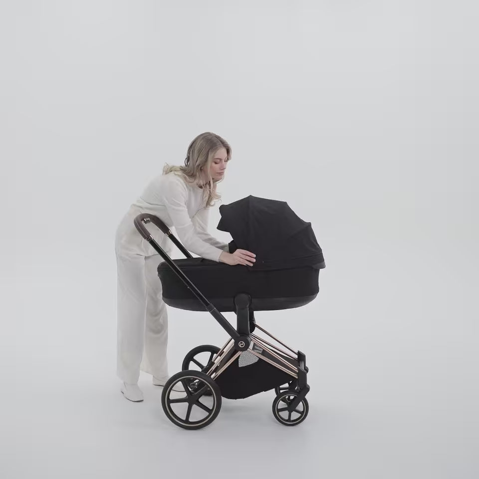 Load video: Cybex Platinum® Priam™ 2-in-1 Stroller with Foldable Carry Cot Comfort Sepia Black | Rosegold