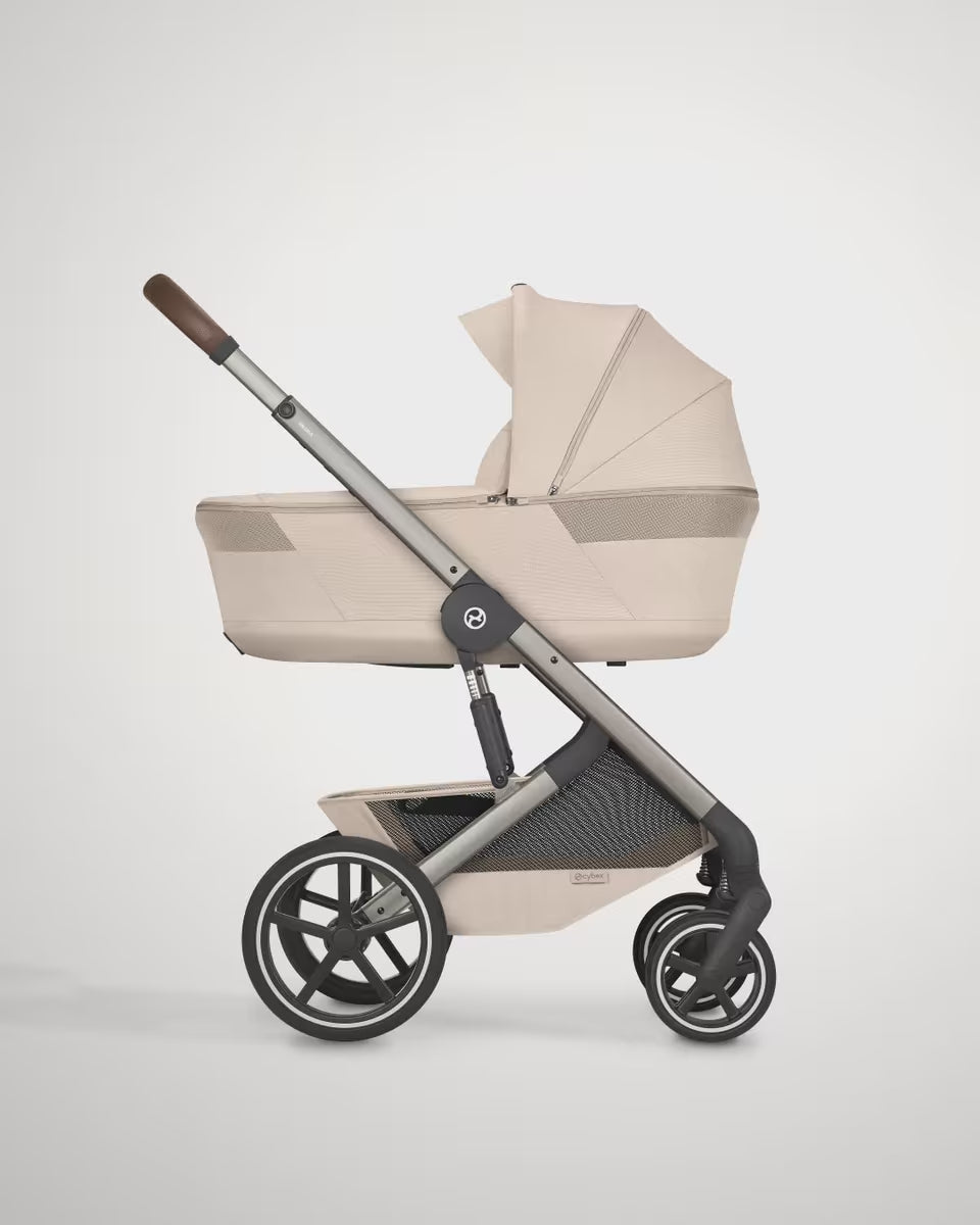 Load video: Cybex® Stroller with folding carrycot 4in1 Balios S Lux + Carrier Amya + Car seat Cloud G3 + IsoFix base G3 Almond Beige (+ Rain cover)